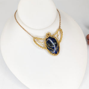 Scarab inspired lapis lazuli wire wrapped pendant in gold plated wire